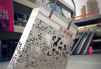 兰州购物袋雕塑-步行街室外锻造刻字不锈钢购物袋雕塑